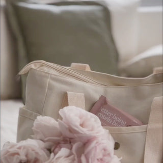 Video showing the Sneaky Wholefoods Vanilla Cookie Dough Protein Bar being packed in a bag, followed by a woman happily on her way to work, demonstrating how easy it is to stay nourished throughout a busy day